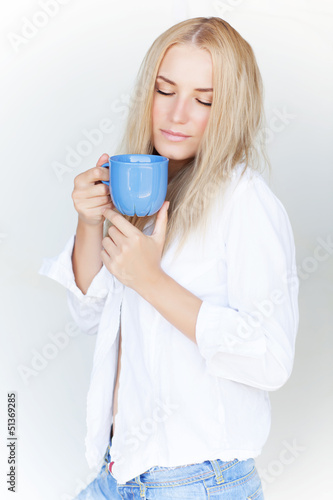 Photo: Blond female with cup of tea Blond female with cup of tea