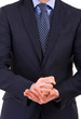 Businessman gesturing with both hands.