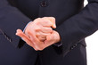 Businessman gesturing with both hands.