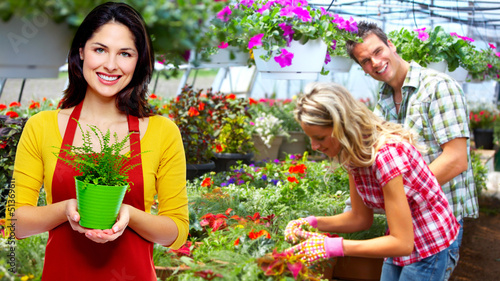 Photo: Gardening woman with plant. Gardening woman with plant.