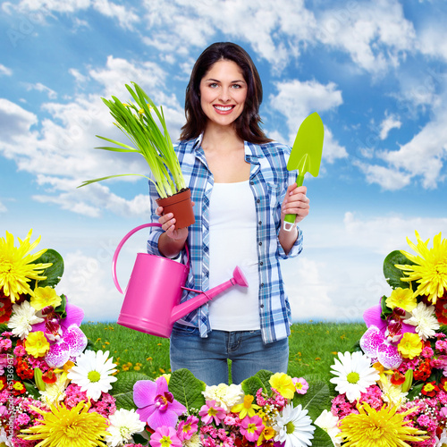 Photo: Gardening woman with plant. Gardening woman with plant.