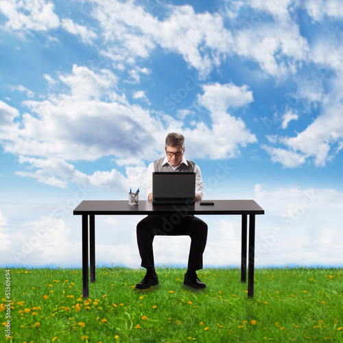 Photo: Businessman working with laptop. Businessman working with laptop.