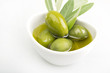 Olives and Olive Oil close up on white