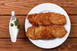 Potato pancakes with sour cream sauce top view