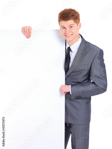 Photo: The young handsome businessman isolated The young handsome businessman isolated