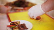 man chef cuts the meat on board