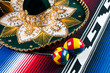 Traditional mexican sombrero, maracas and multi-colored poncho