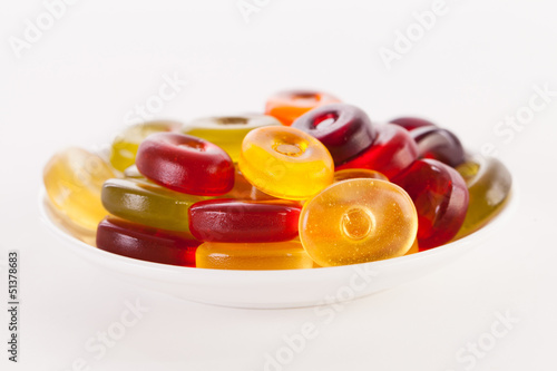 Photo: Bright candies isolated on a white background Bright candies isolated on a white background