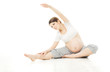 Pregnant woman exercise sport over white background