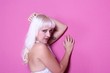 Girl with pink wall