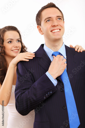 Photo: Businessman dressing at home in the morning Businessman dressing at home in the morning