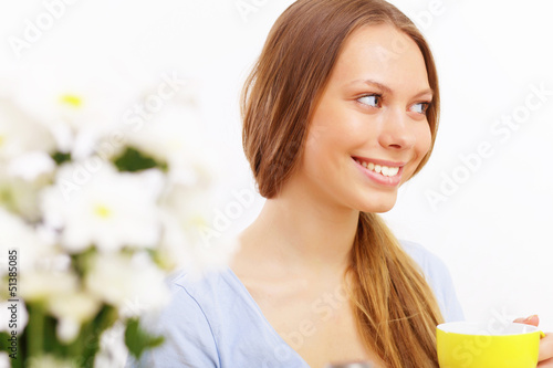 Photo: Beautiful young woman drinking tea Beautiful young woman drinking tea