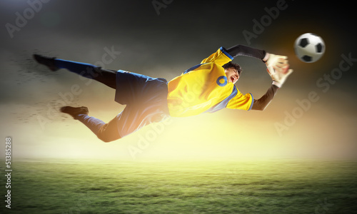 Photo: Goalkeeper catches the ball Goalkeeper catches the ball