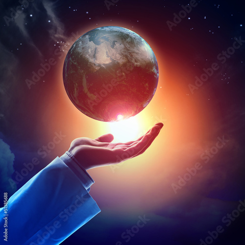 Photo: Image of earth planet on hand Image of earth planet on hand