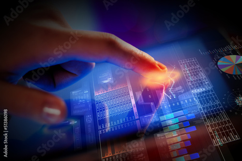 Photo: Closeup of finger touching tablet-pc screen Closeup of finger touching tablet-pc screen