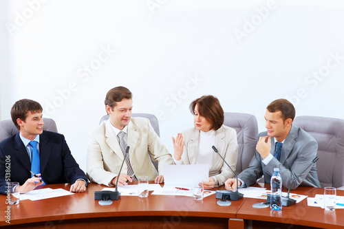 Photo: Four businesspeople at meeting Four businesspeople at meeting
