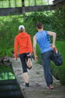 Photo: Caucasian couple warming up before running training Caucasian couple warming up before running training