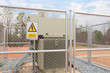 Danger High Voltage sign on a fence