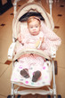 Baby in sitting stroller