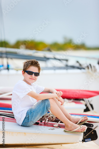 Photo: Cute boy on beach vacation Cute boy on beach vacation