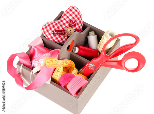 Photo: Box with the materials at hand sewing isolated on white Box with the materials at hand sewing isolated on white
