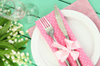 Table setting in white and pink tones