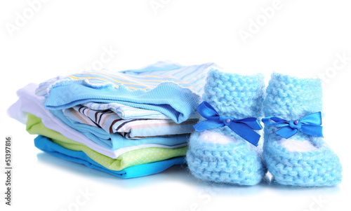 Photo: Pile of baby clothes isolated on white Pile of baby clothes isolated on white