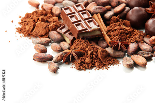Photo: Composition of chocolate sweets, cocoa and spices, isolated Composition of chocolate sweets, cocoa and spices, isolated