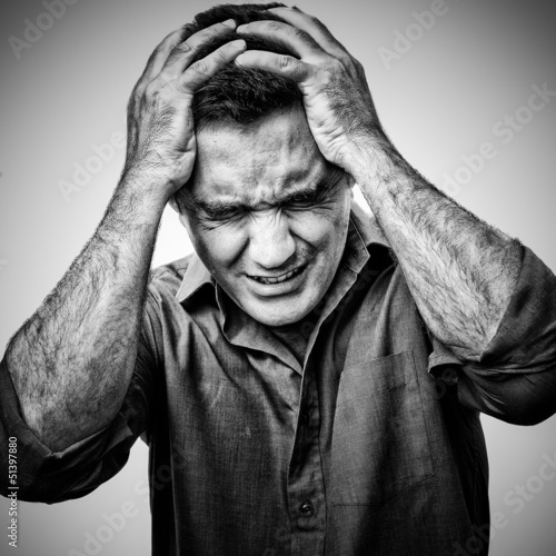 Photo: Black and white image of an angry sufering man in pain Black and white image of an angry sufering man in pain