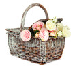 Picnic basket with flowers, isolated on white