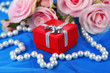 Rose And Gift Box On Blue Cloth
