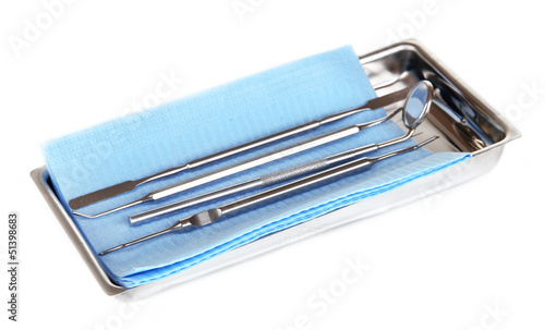 Photo: Dentist tools isolated on white Dentist tools isolated on white