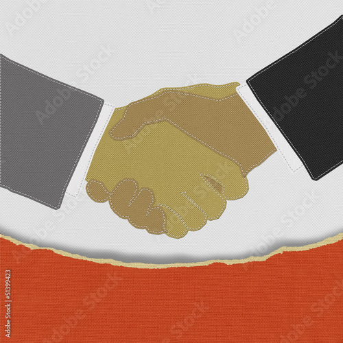 Photo: Businessmen shaking hands with stitch style on fabric background Businessmen shaking hands with stitch style on fabric background