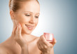 skin care.  beauty  woman with eyes closed with jar of cream