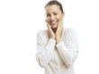 Photo: Young woman looking surprised against white background Young woman looking surprised against white background