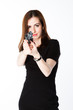 Young and beautiful woman with a gun