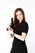 Young and beautiful woman with a gun