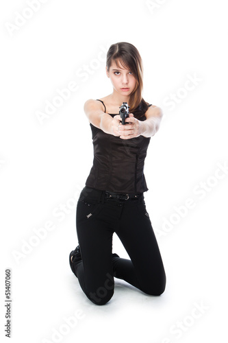 Photo: Young and beautiful woman with a gun Young and beautiful woman with a gun