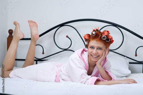 Photo: girl in curlers on the bed girl in curlers on the bed