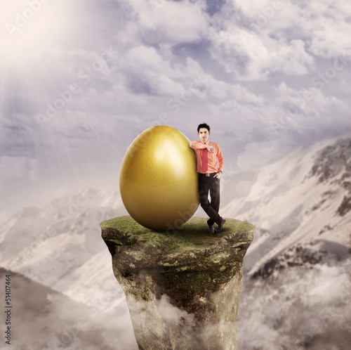 Photo: Businessman has gold idea on top Businessman has gold idea on top
