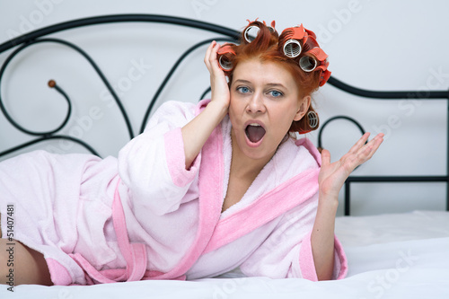 Photo: girl in curlers on the bed girl in curlers on the bed