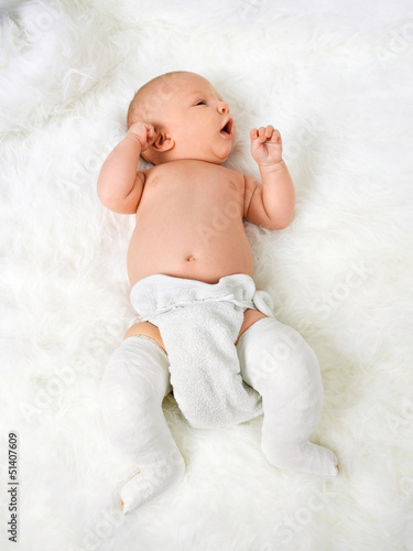 Photo: Newborn baby boy with legs wrapped in bandage Newborn baby boy with legs wrapped in bandage