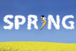 Happy Woman jumping with flower