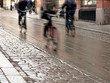 Photo: Cyclists on wet street Cyclists on wet street
