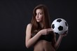 sexy woman in lingerie with classic soccer ball