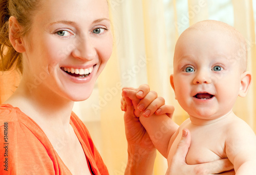 Photo: Mother and son play in the bedroom Mother and son play in the bedroom
