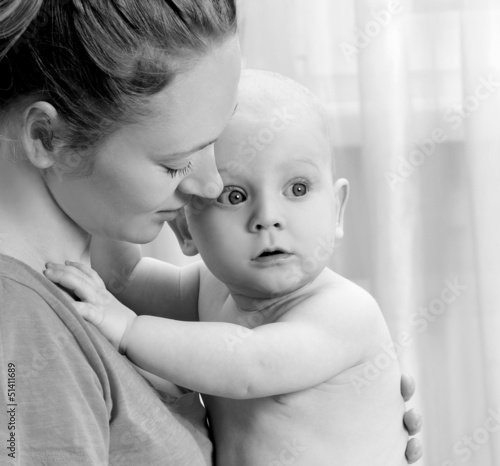Photo: Mother and son play in the bedroom Mother and son play in the bedroom