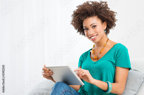 Photo: African Woman Using Digital Tablet African Woman Using Digital Tablet