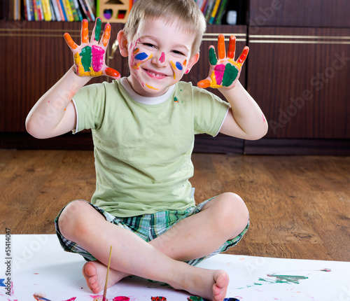 Photo: Cute happy boy painting Cute happy boy painting