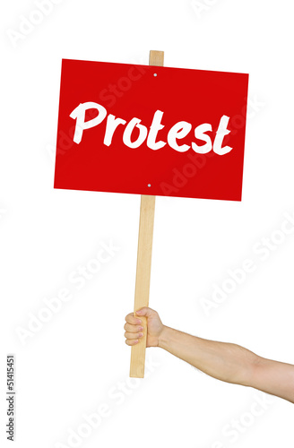 Photo: Person hält Schild mit der Aufschrift Protest Person hält Schild mit der Aufschrift Protest